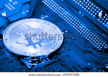 close up of Bitcoin money mining on graphic card,we see the technology of the mainboard,which is the important background of the computer.