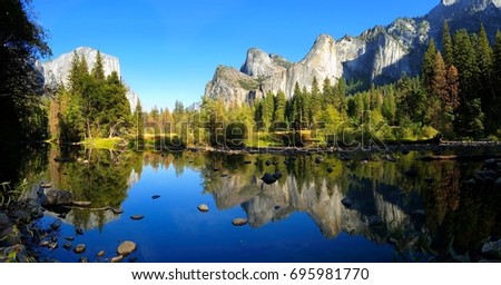 Panoramic Yosemite Valley view over the river with beautiful reflection, California, USA Royalty-Free Stock Photo #695981770