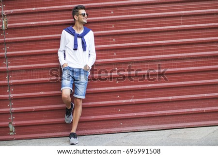 fashionable teenager on the wall of the street
