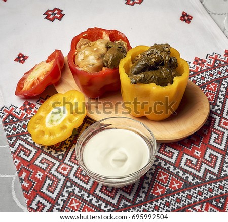 Traditional russian or moldavian or ukrainian food called golubtsi. Cabbage roll, golubtsi on traditional ornamental background, traditional Ukrainian cuisine 