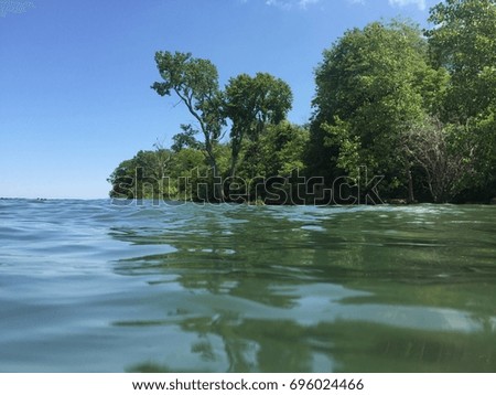 Photo takes from the water looking at the island coast