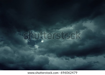 Background of dark clouds before a thunder-storm Royalty-Free Stock Photo #696062479
