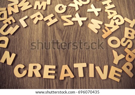 word creative made with wooden letters. Wooden illustration background