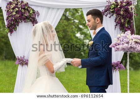Wedding couple in the park. Bride and groom. Love and feelings.