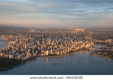 Vancouver Downtown City, British Columbia, Canada. Aerial picture taken during a cloudy summer sunset from an airplane.
