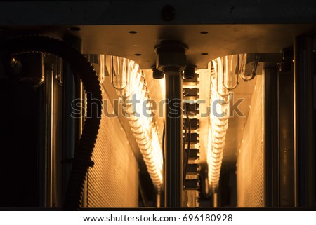 The pre-heat process of plastic bottle blowing process.Hi-technology production process.