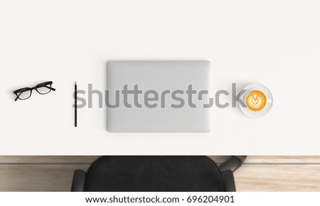 Modern workplace with laptop, coffee cup and notebook copy space on white table background. Top view. Flat lay style.