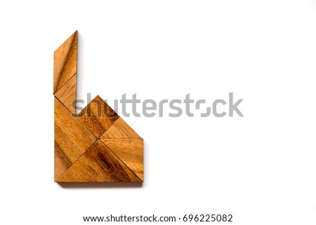 Wooden tangram puzzle in factory or home shape on white background