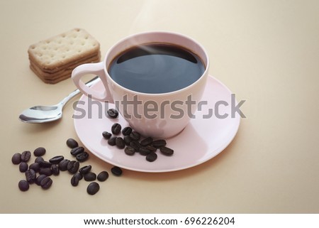 Pink coffee cup and coffee bean on paper ground, vintage Concept