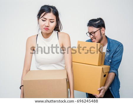 Woman and man carry boxes. Start up small business entrepreneur SME or freelance woman and man working at home concept, online marketing packaging box and delivery, SME and delivery concept 