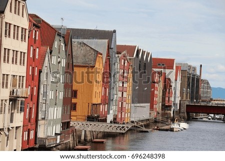The pictures of connects to the residential and business areas ,the old church with the priest graves and homes decorations with flowers and so on. Trondheim was the old capitol city of Norway.
