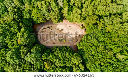 Top view of a sports field in the forest. Aerial view.