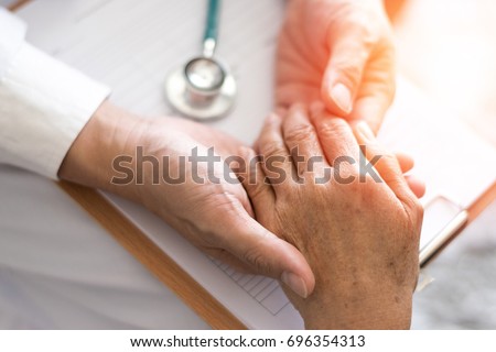 Parkinson and alzheimer female senior elderly patient with physician doctor in hospice care. Royalty-Free Stock Photo #696354313