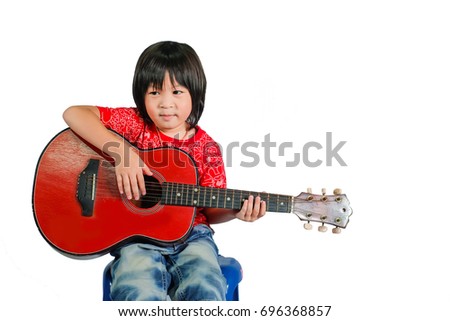 Cute boy play guitar.Asia kid play music instrument.Thai smart boy with a guitar.isolate on white  background