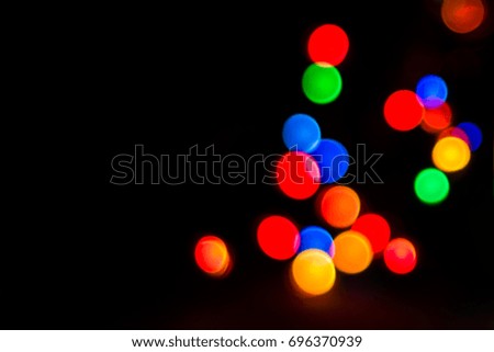Bright and colorful festive abstraction glowing garlands in blur