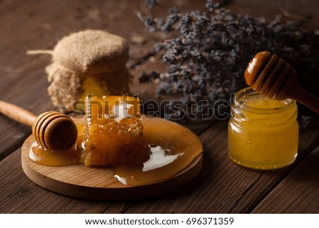 honey dipper and honeycomb. nuts and apples with honey and nuts of various kinds