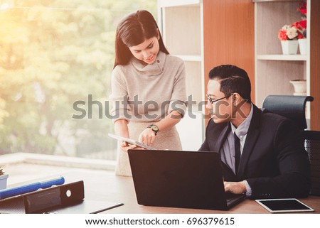 Businessman And Businesswoman Meeting In Modern Office.