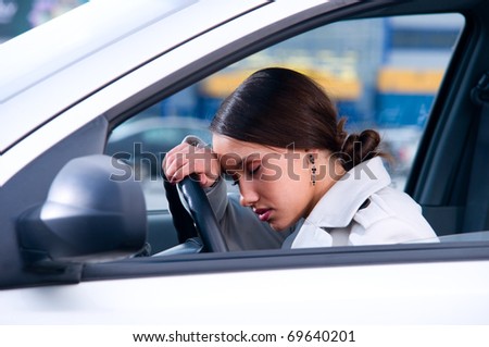 beautiful woman is sleeping in a car Royalty-Free Stock Photo #69640201