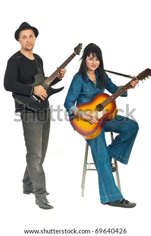 Beautiful couple playing electronical and acoustic guitars isolated on white background