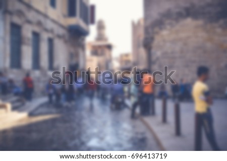 blurred background of people walking in the street