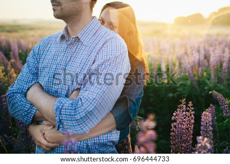 Young couple in love walking  in the sunset
