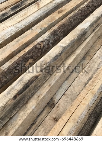 Sawn wooden boards and bars in a pack in stock, Russia