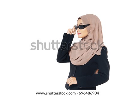 Portrait of beautiful muslim girl wearing glasses at studio