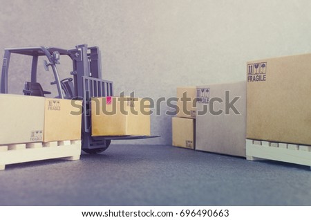 Forklift truck with boxes delivery and transportation logistics storage warehouse industry business commercial concept.