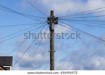 Telegraph pole with many cables