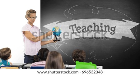 Teacher with students holding globe against teaching against black background