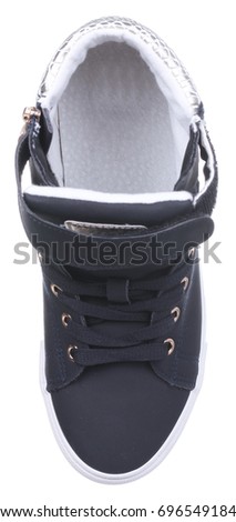 Upper view of black, white and grey boy high sneaker (gum shoe) with velcro clasp, metal zipper and shoelaces, isolated on white (FOCUS ON INSOLE)