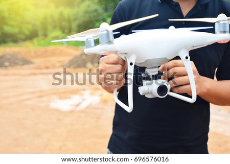 Set up drone camera with hand of professional