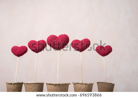 Crocheted hearts in peat glasses