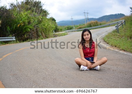 portrait of young woman on the road