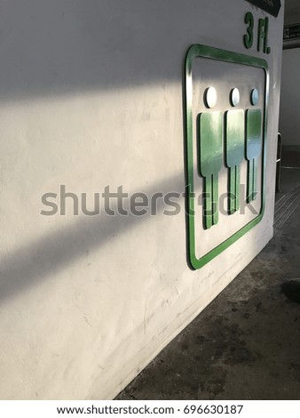 Symbol on the wall and the light of sunset.