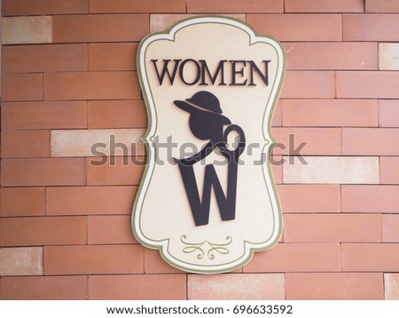 Female toilet sign on the vintage wall