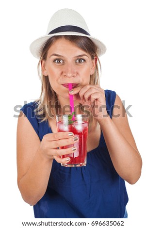 Picture of a beautiful young woman holding a raspberry mint lemonade posing on isolated background on summertime