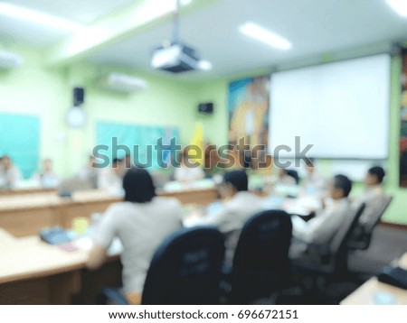 People sitting in meeting room, blurred image