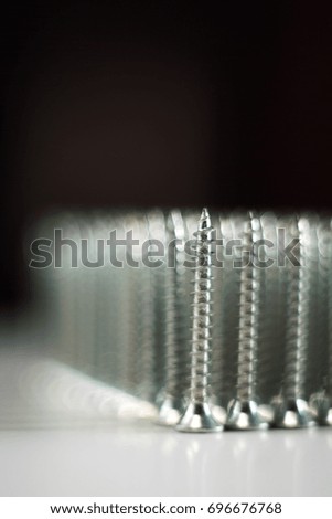 Screws beautifully lined / a lot of screws built in close-up rows / Screws