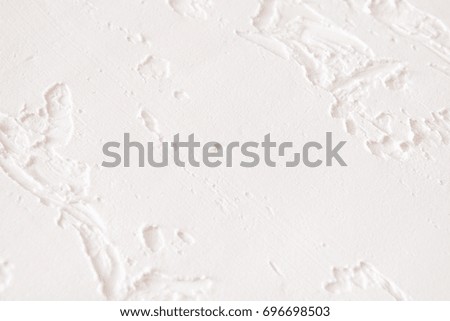 White wall with plaster pattern background. Textured backdrop, bas-relief. House repair, interior design concept