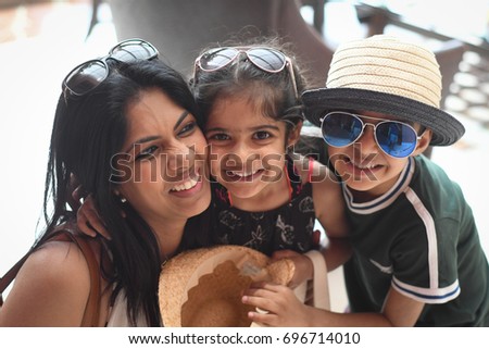 Mother and her two children on holiday.