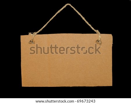Blank cardboard tag tied isolated on black background