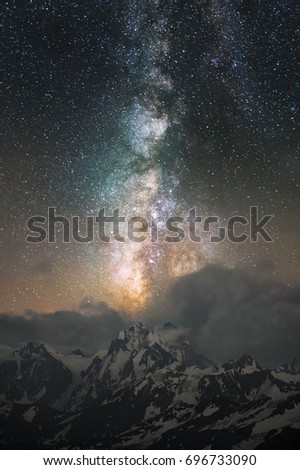 Milky Way leaving in clouds over Mount Ushba in the Caucasus