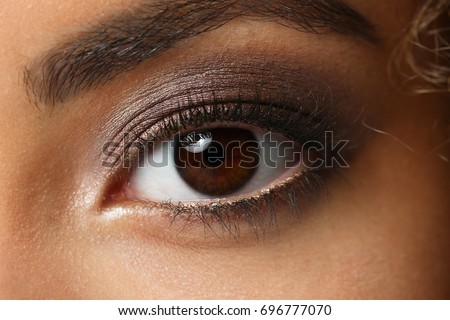 Eye of a black woman shot large macro Royalty-Free Stock Photo #696777070