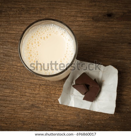 chocolate with white milk glass on wood. morning.
