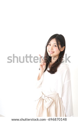 Young woman pointing something with smile