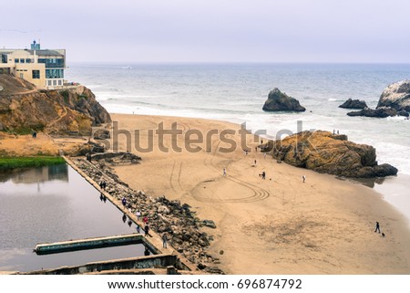 Ruins of the Sutro baths on a cloudy day; the Cliff house in the background, Lands End, San Francisco, California