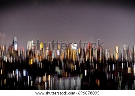Abstract of city night light view. Draw photo with colorful light at night. Movement pattern. Blurred background. Dark side in town. Busy and confused. Fun but stressed.