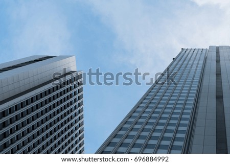 A group of modern skyscrapers in the city with beautiful sky and clouds.