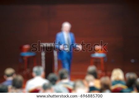 blur event seminar with activity on stage - blurred background - bokeh light vintage tone - business concept.